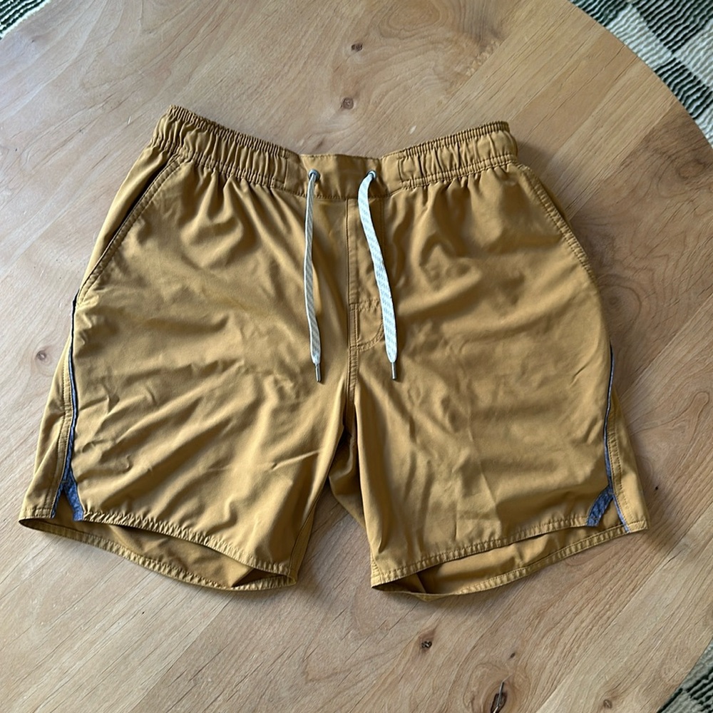 Vuori Men's Athletic Shorts in Mustard Yellow